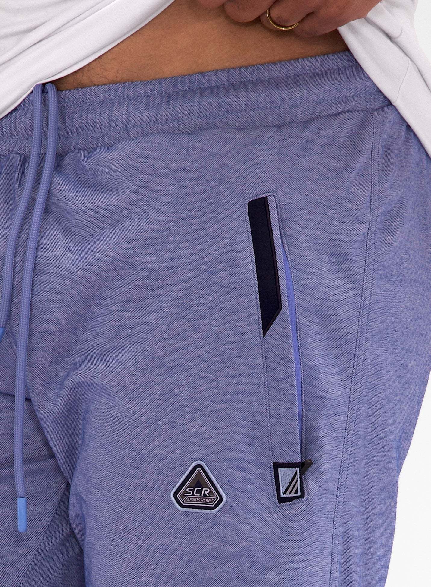 Urban Stride All-Day Wear Shorts in heathered blue cotton-polyester fabric, with a drawstring waist, zip pocket and badges