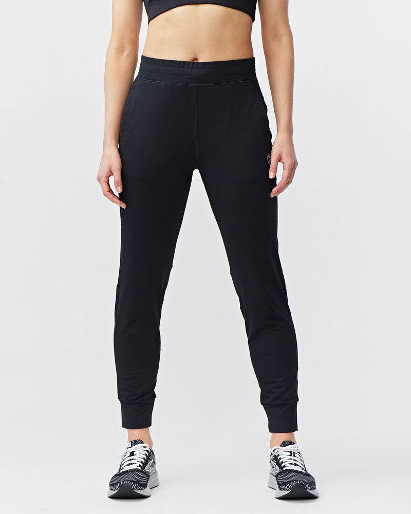Valia Women's Black Jogger Pants in smooth black fabric, with a slim athletic fit, tapered legs and elastic cuffs