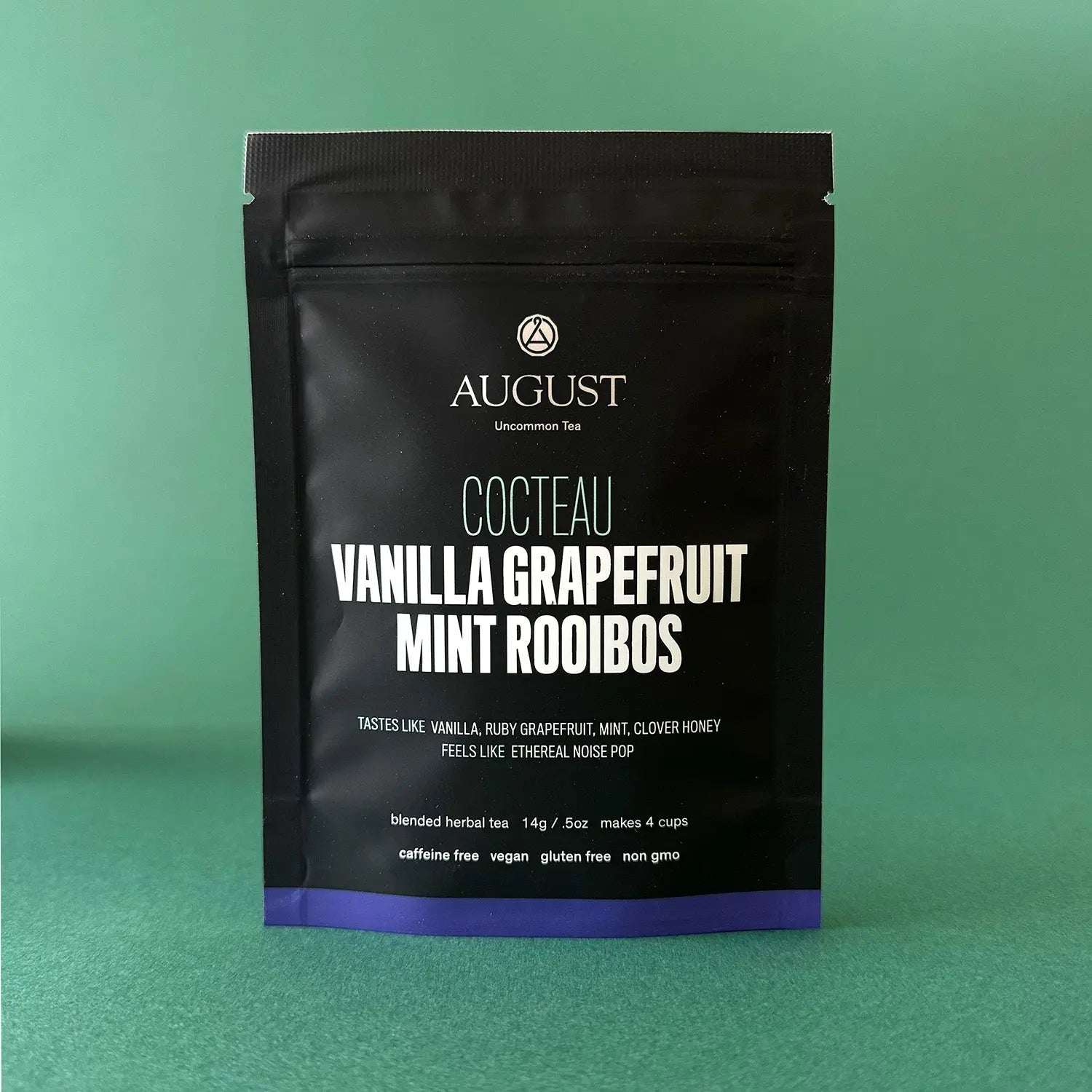 Vanilla Grapefruit Mint rooibos tea in a black resealable pouch with white lettering and a purple bottom band