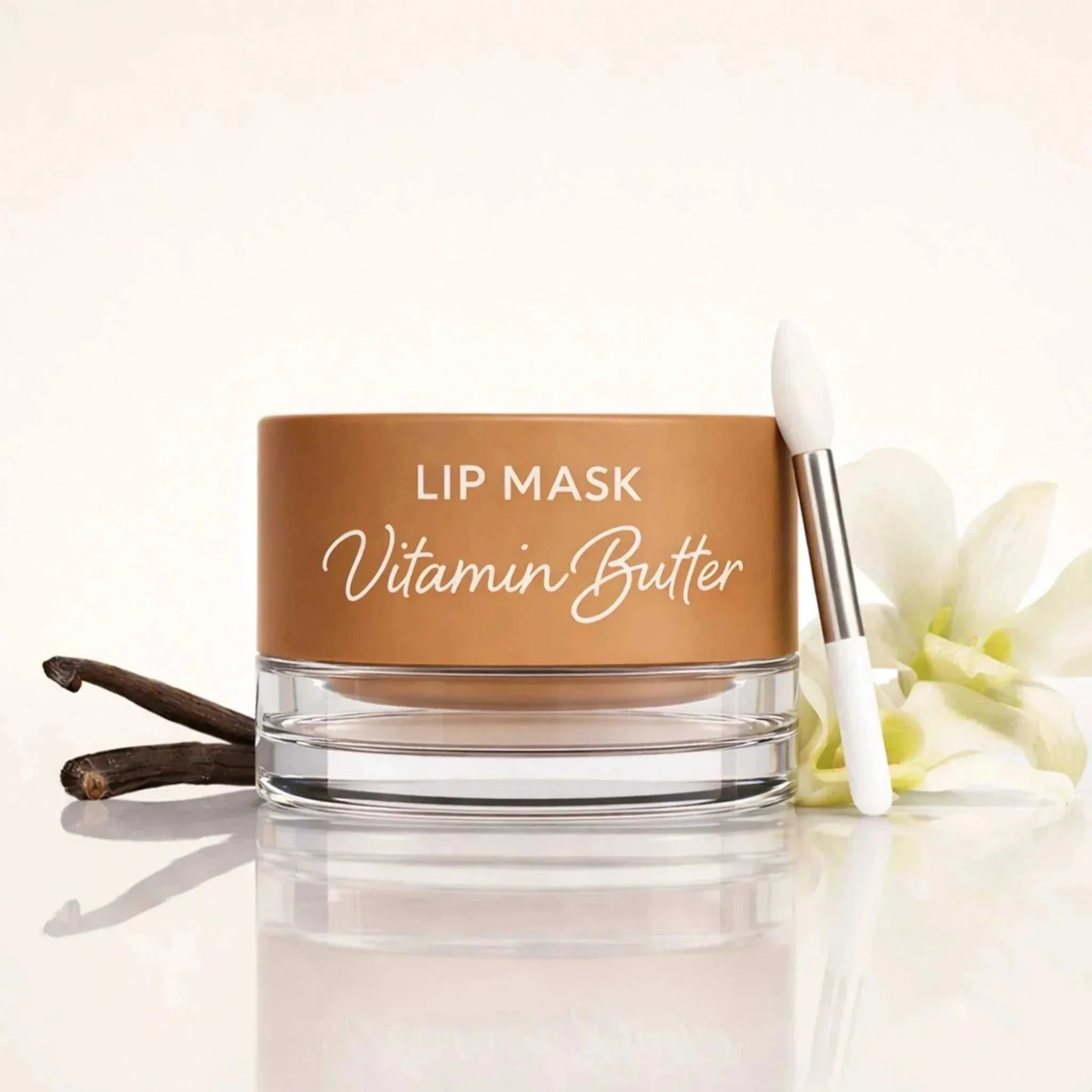 Vanilla plumping lip balm with silicone brush on white background