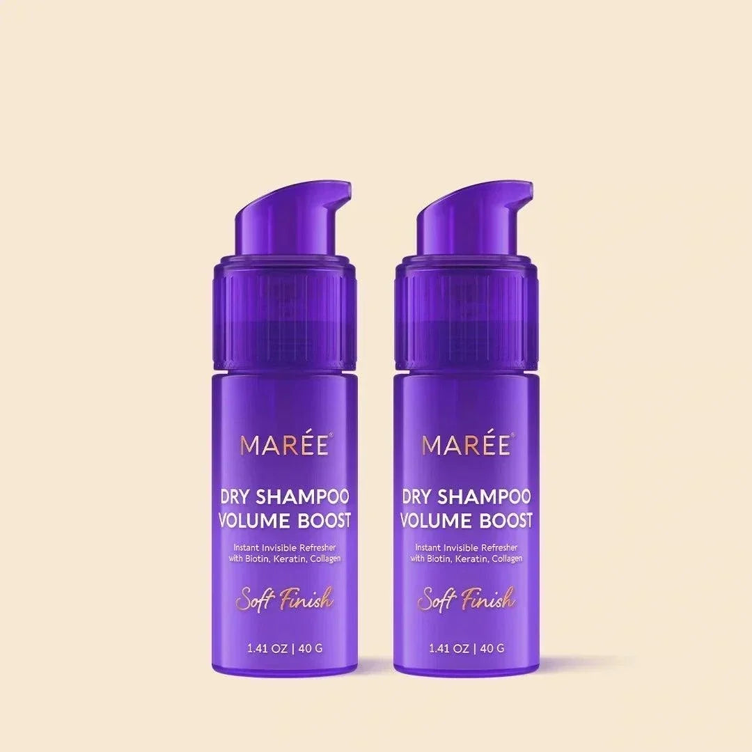 Volumizing Dry Shampoo Powder in two purple pump bottles with gold lettering and a soft finish label