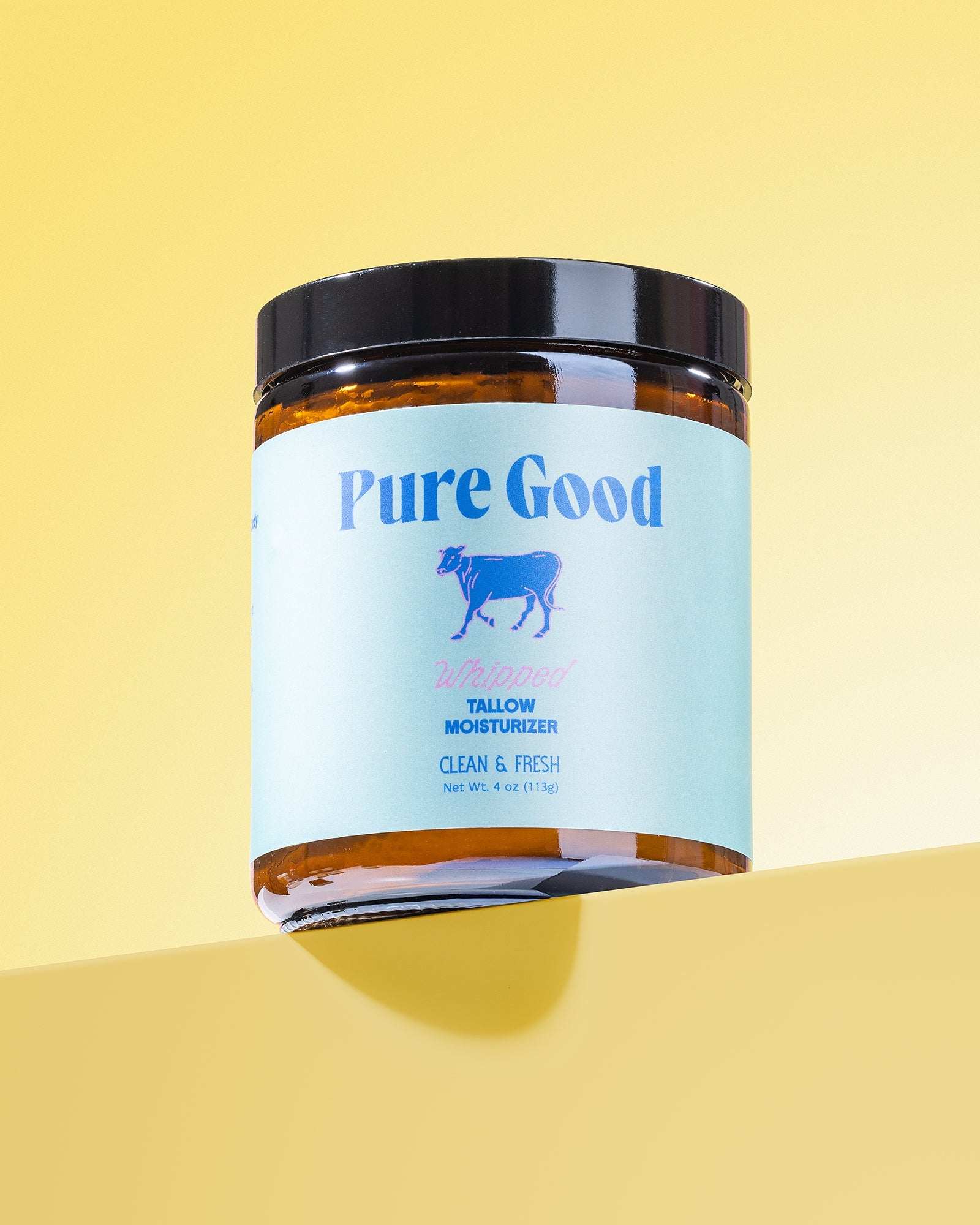 Whipped Tallow Moisturizer in an amber jar with black lid and light blue Pure Good Clean & Fresh label
