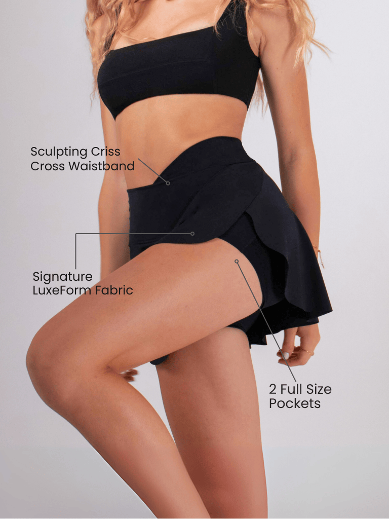 Women's Athletic Skort in black sculpting fabric with a criss-cross waistband, built-in shorts and two full-size pockets