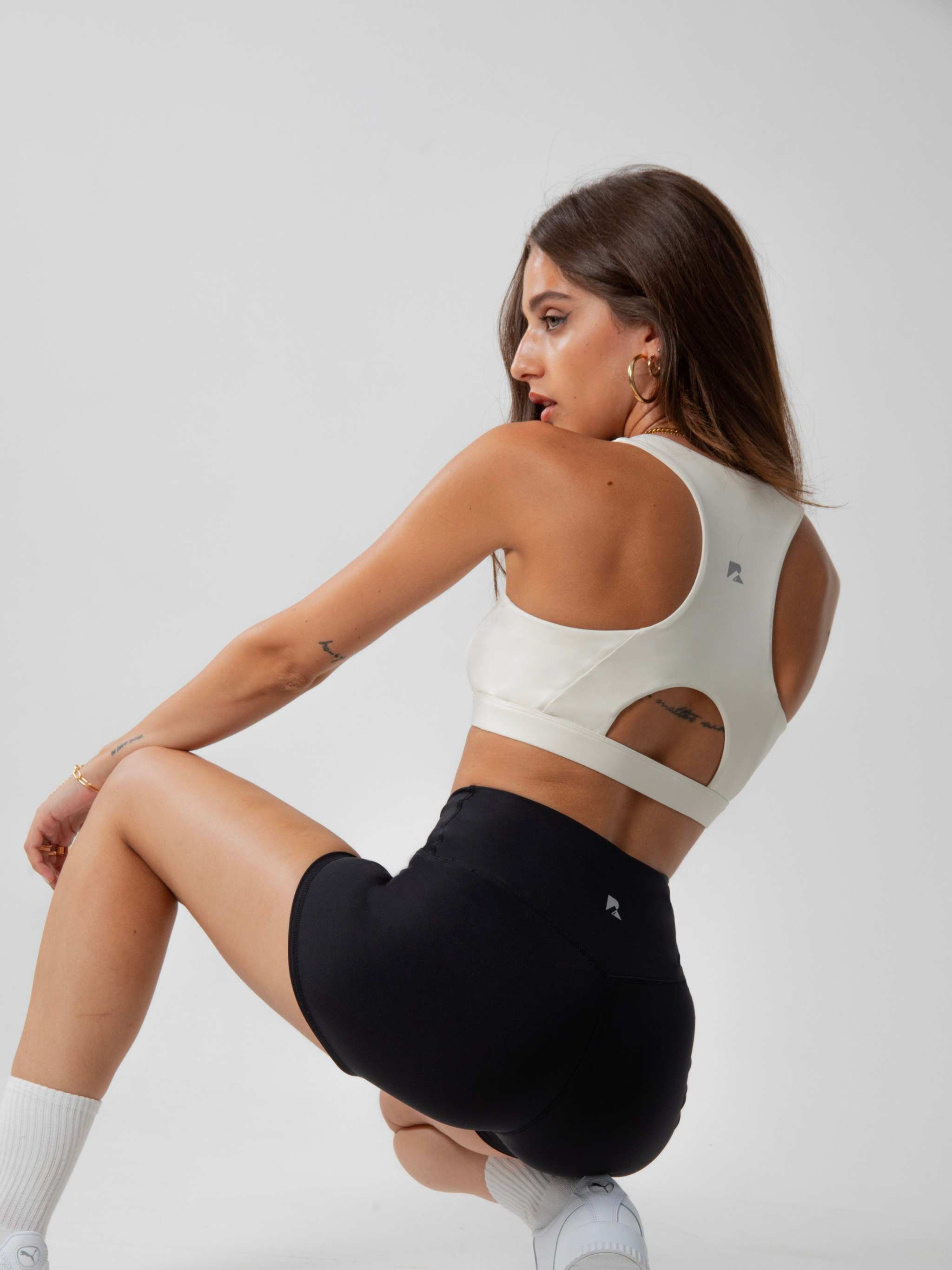 Women's Heart Neckline Sports Bra in ivory smooth stretch fabric, with a wide racerback and open back cutout