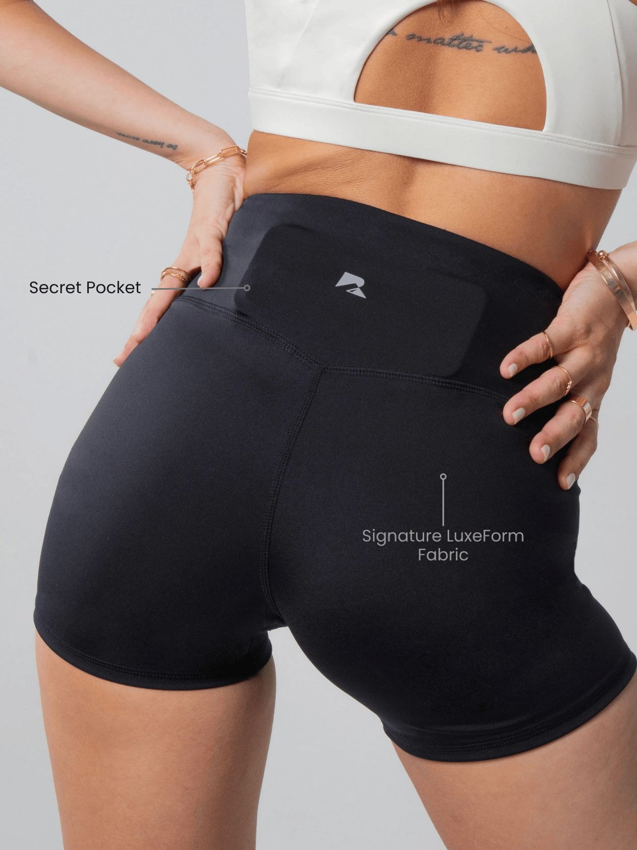 Women's Sculpting Workout Shorts in black stretch fabric, with a smooth finish, high waistband, and discreet back pocket
