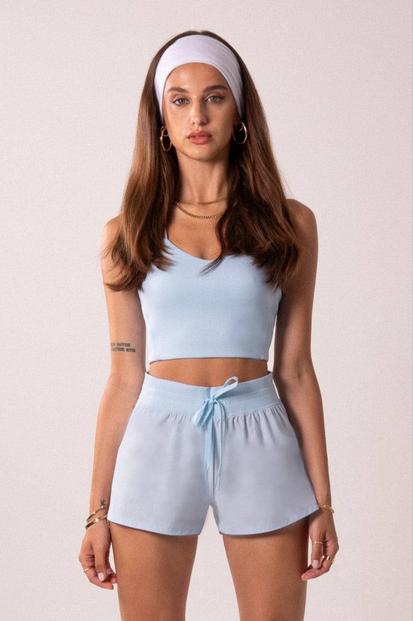 Women's Workout Tank Top in pale blue with a smooth stretch fabric, cropped fit, and simple scoop neckline