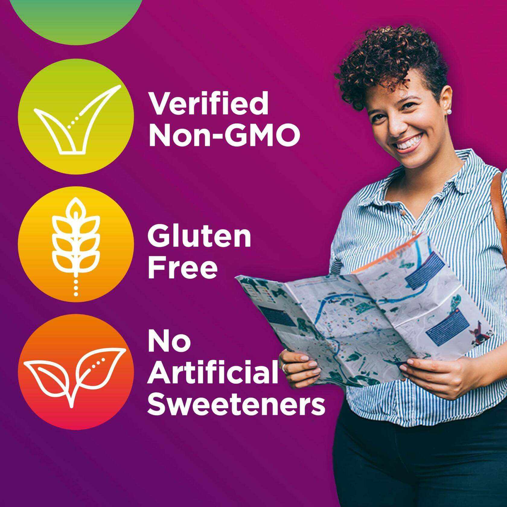 Smiling woman holding city map next to colorful icons highlighting verified non-GMO, gluten free, no artificial sweeteners for women's multivitamins with iron